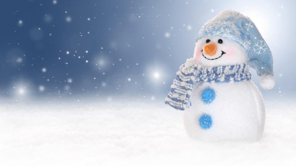 Snowman with blue white woolen knitted muffler and cap wallpaper