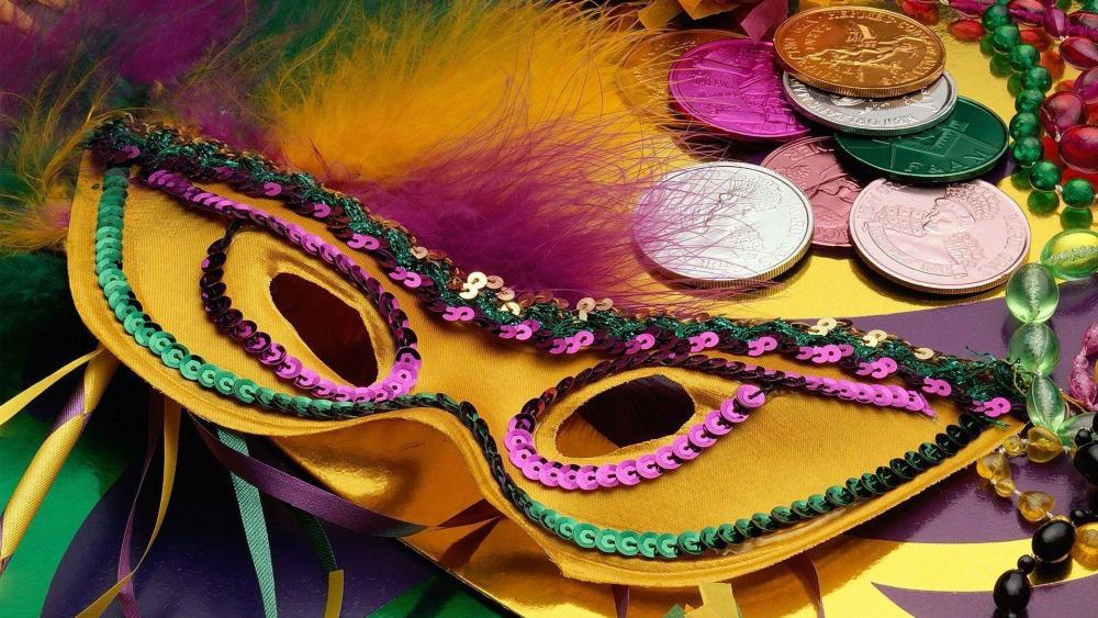 Yellow Mardi Gras mask with coins wallpaper