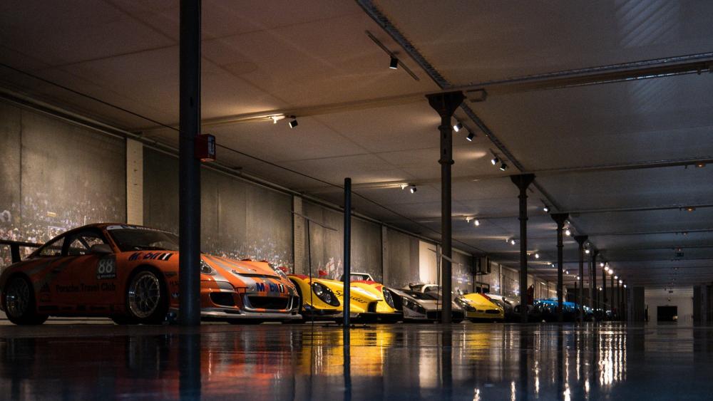 Sleek Sports Cars in a Sophisticated Garage wallpaper