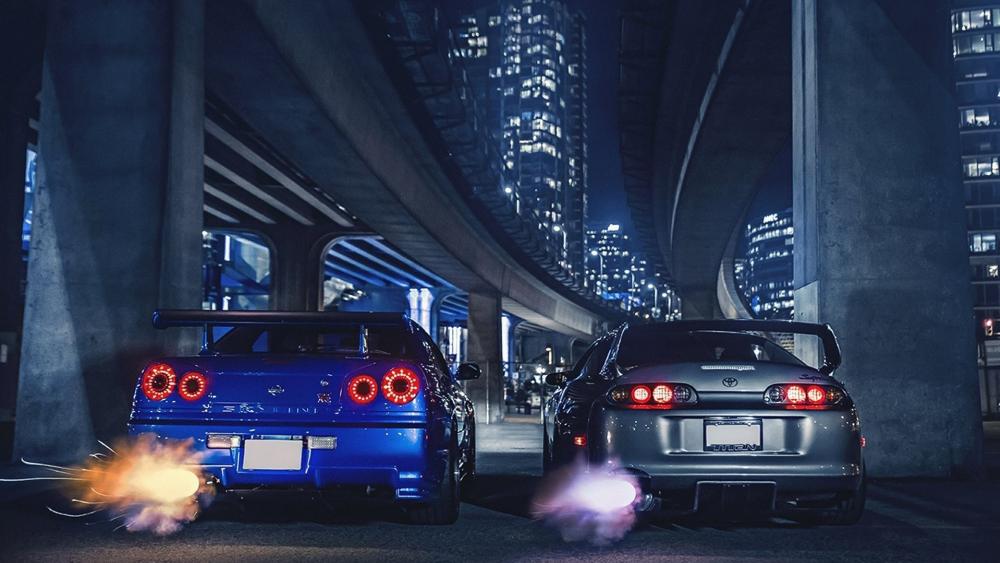 Nissan Skyline GTR-R34 and Toyota Supra MK4 wallpaper