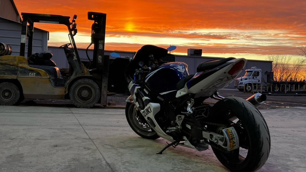 Breathtaking Sunset with a Motorcycle Scene wallpaper