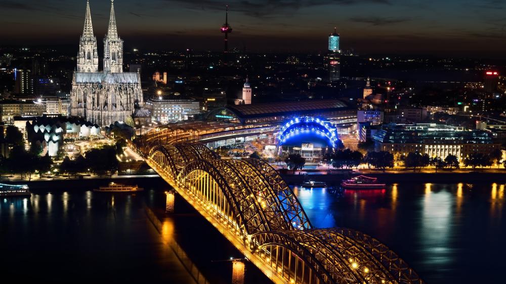 The Hohenzollern Bridge and the Cologne Cathedral by night wallpaper