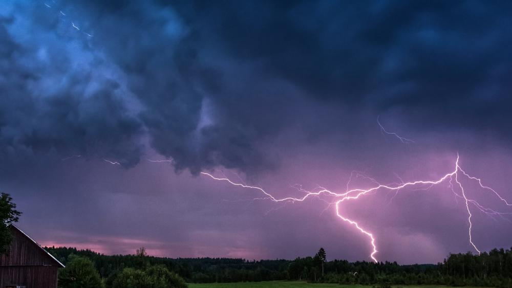 Spectacular Lightning Dance Over Rural Landscape wallpaper