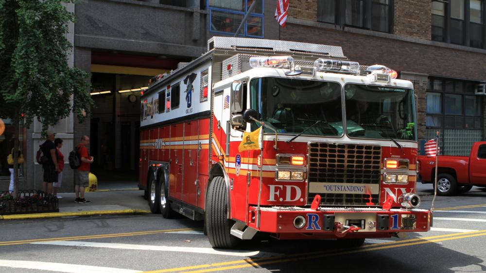 Fire Engine in Urban Setting Wallpaper 5k wallpaper