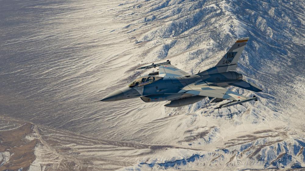 Aggressor F-16 over mountains wallpaper