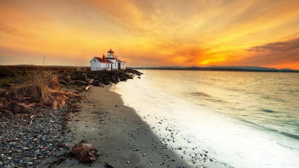 Waves and Sunset Embrace the Lighthouse wallpaper