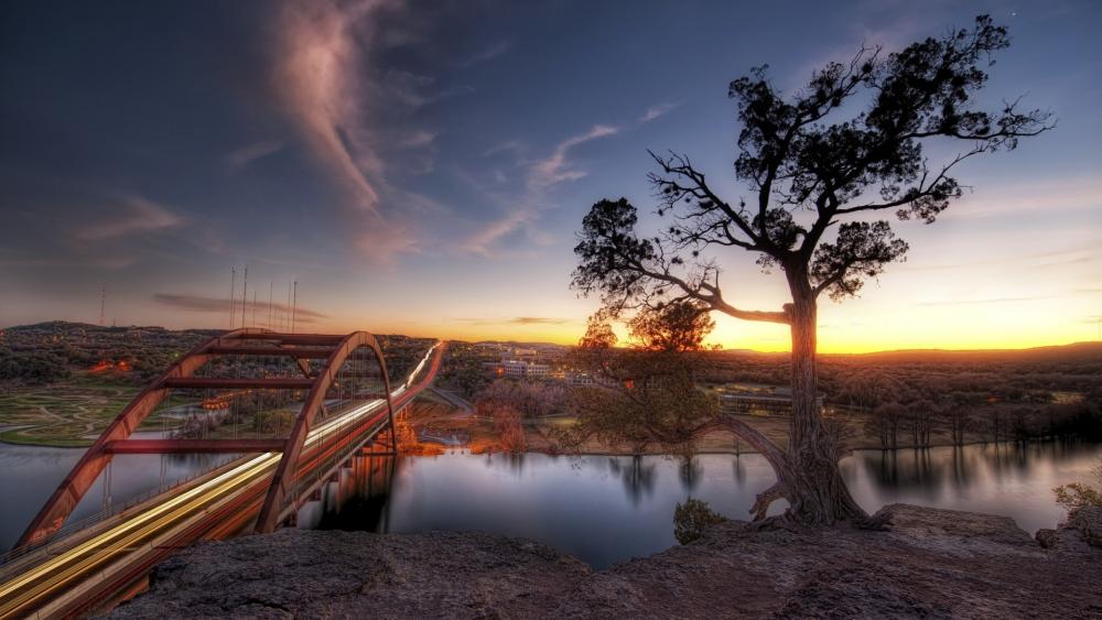 Serene Sunset Over the Bridge and Lake wallpaper