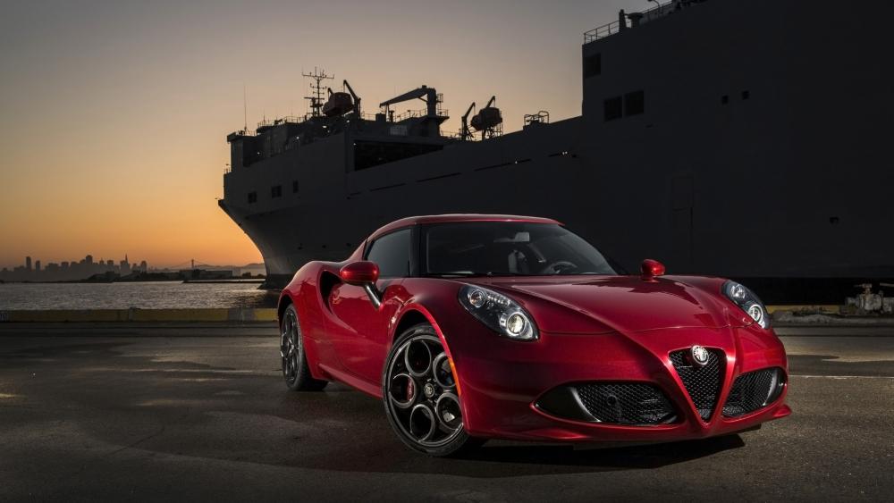 Sleek Car Against Majestic Sunset View wallpaper