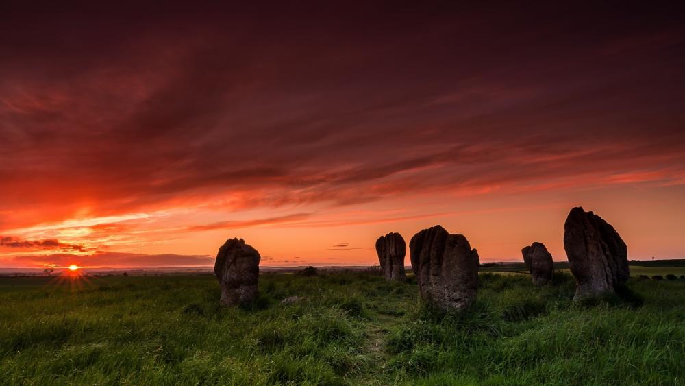 Majestic Sunset Over Ancient Stones in Nature wallpaper