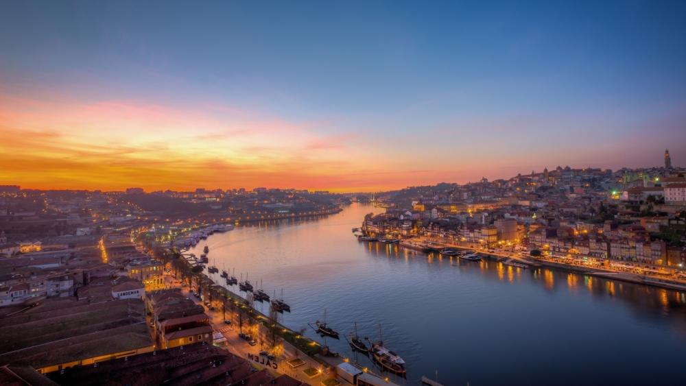 Serene Sunset Over a Vibrant Cityscape wallpaper