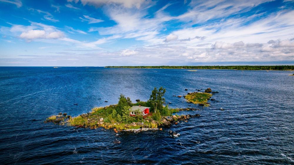 Serene Island Retreat Amidst Tranquil Waters wallpaper