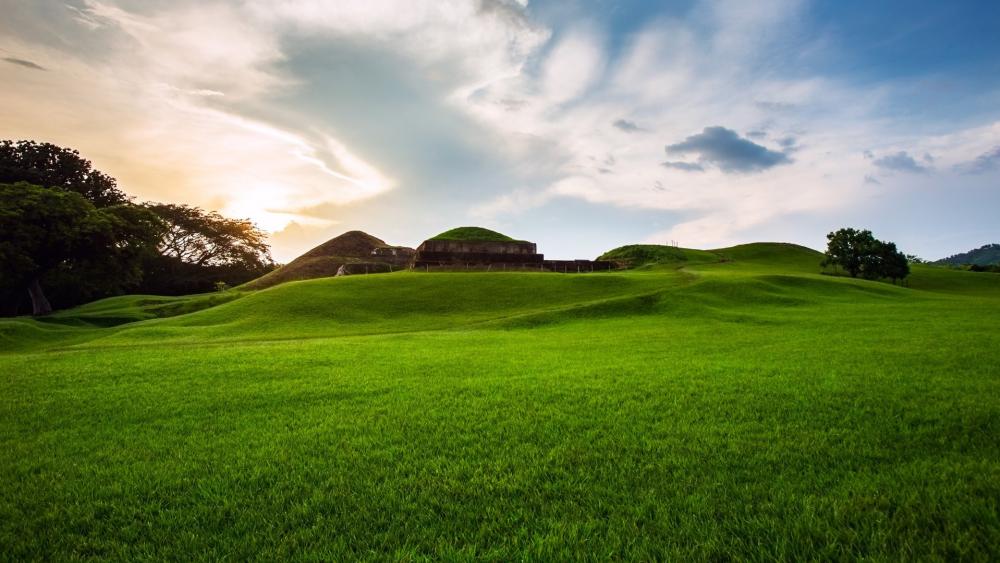 Serene Green Hills Under a Beautiful Sky wallpaper