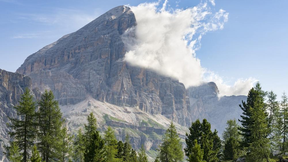Majestic Mountain Clouds in a Serene Landscape wallpaper