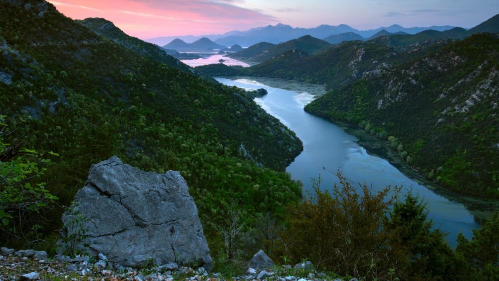 Serene River Valley at Dusk in Nature's Embrace wallpaper