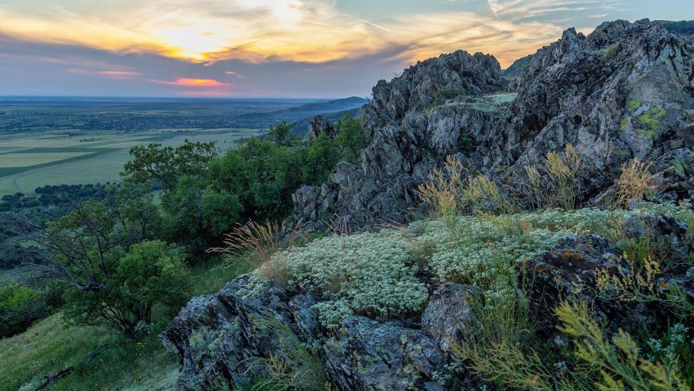 Stunning Sunset Over Rocky Landscape wallpaper