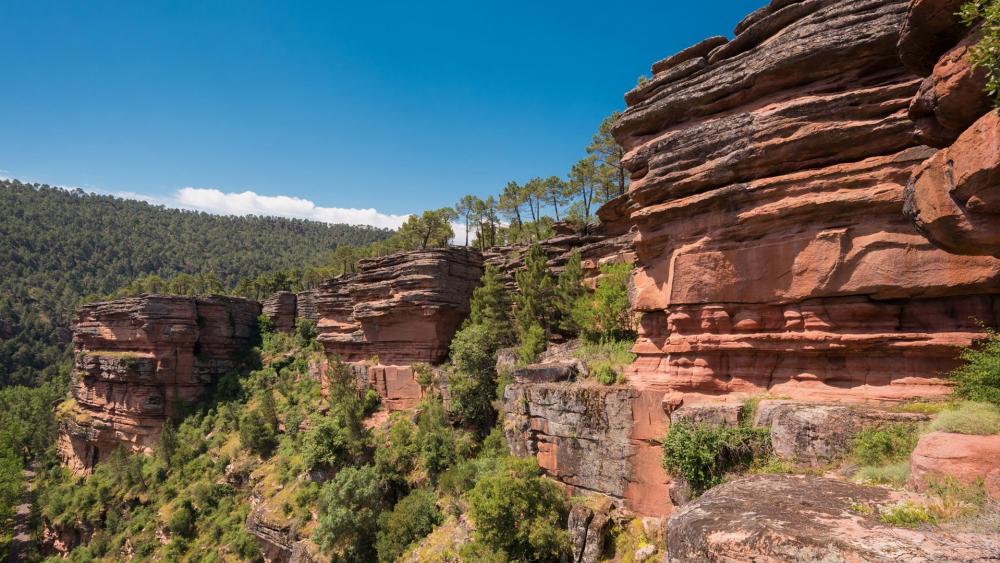 Majestic Canyon Landscape Under Clear Blue Sky wallpaper