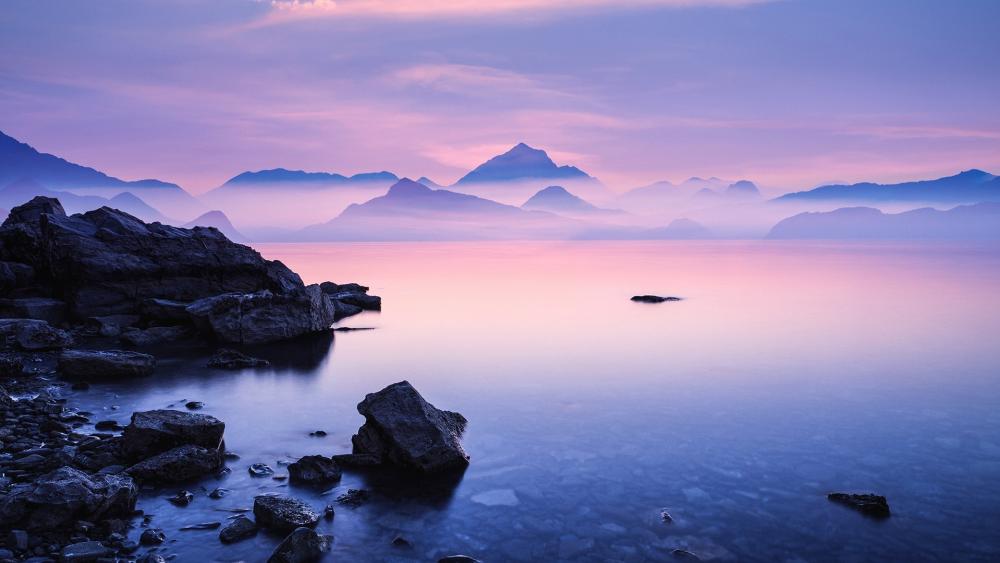 Serene Dawn Over Misty Mountains wallpaper