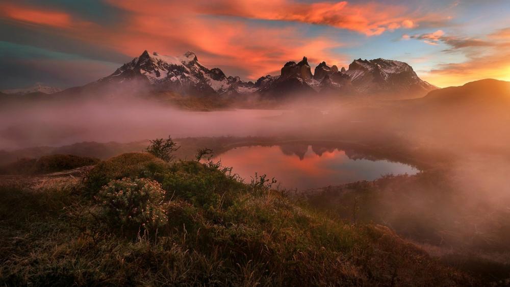 Breathtaking Mountain Sunrise Over Serene Lake wallpaper