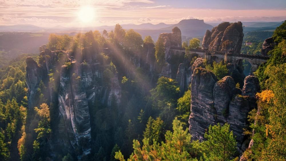 Majestic Sunrise Over Rock Formations wallpaper