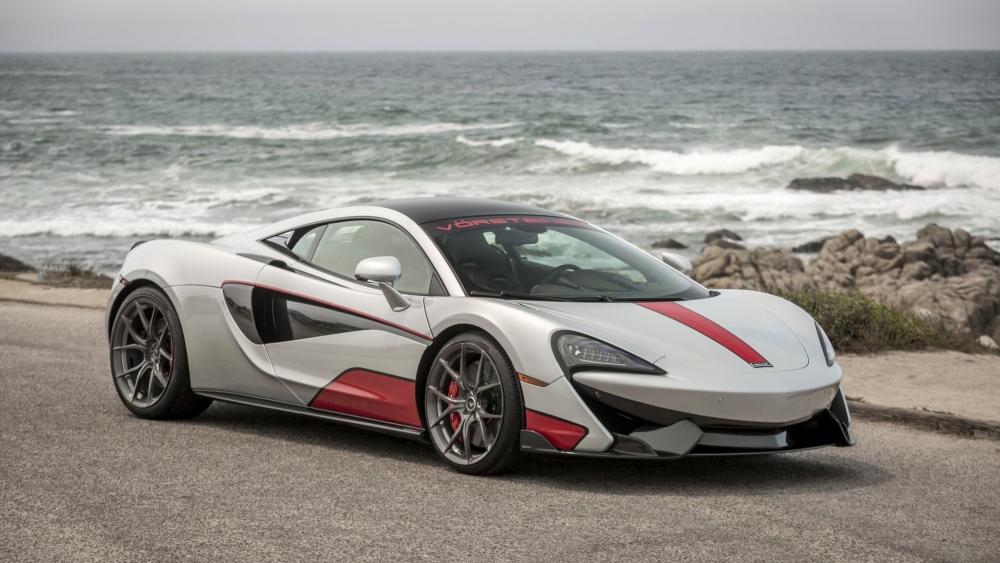 Sleek Silver Sports Car by the Ocean wallpaper