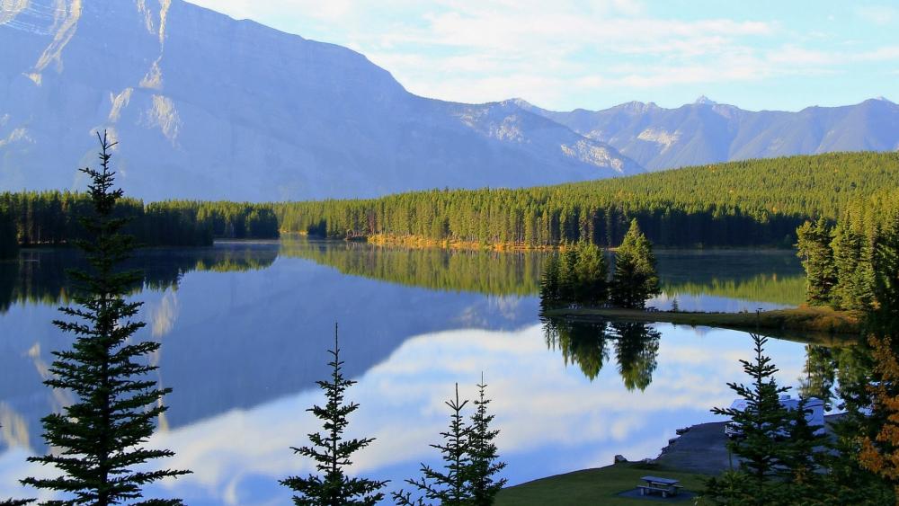 Serene Mountain Reflection Over Tranquil Lake wallpaper