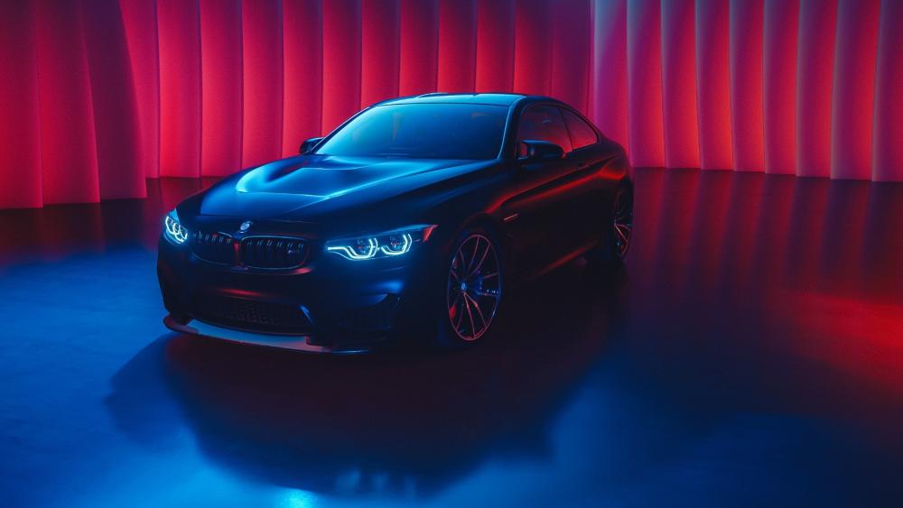 Sleek BMW Under Red and Blue Lights wallpaper