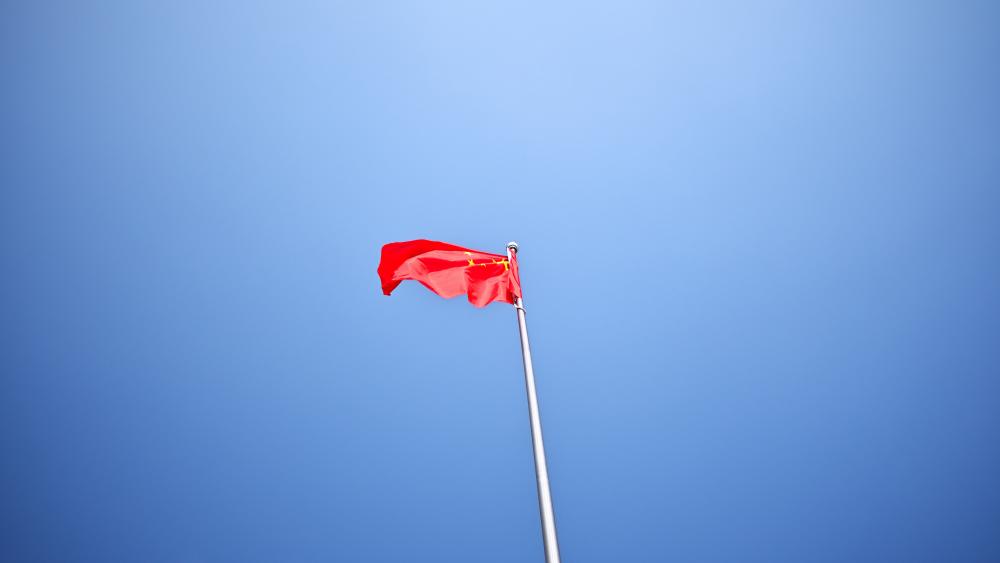 National Flag of the People's Republic of China Flutters in the Wind in Yinchuan City wallpaper