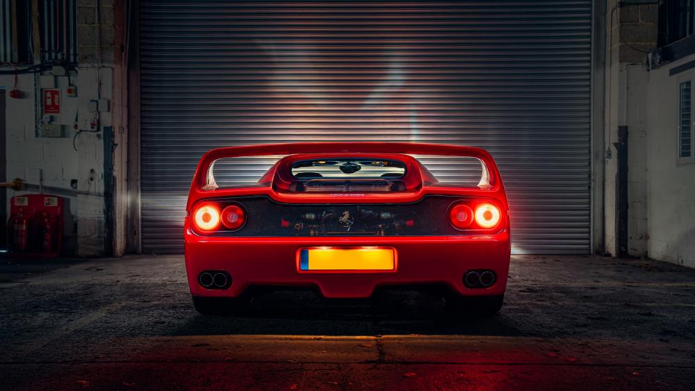 Gleaming Red Ferrari F50 Under Lights wallpaper