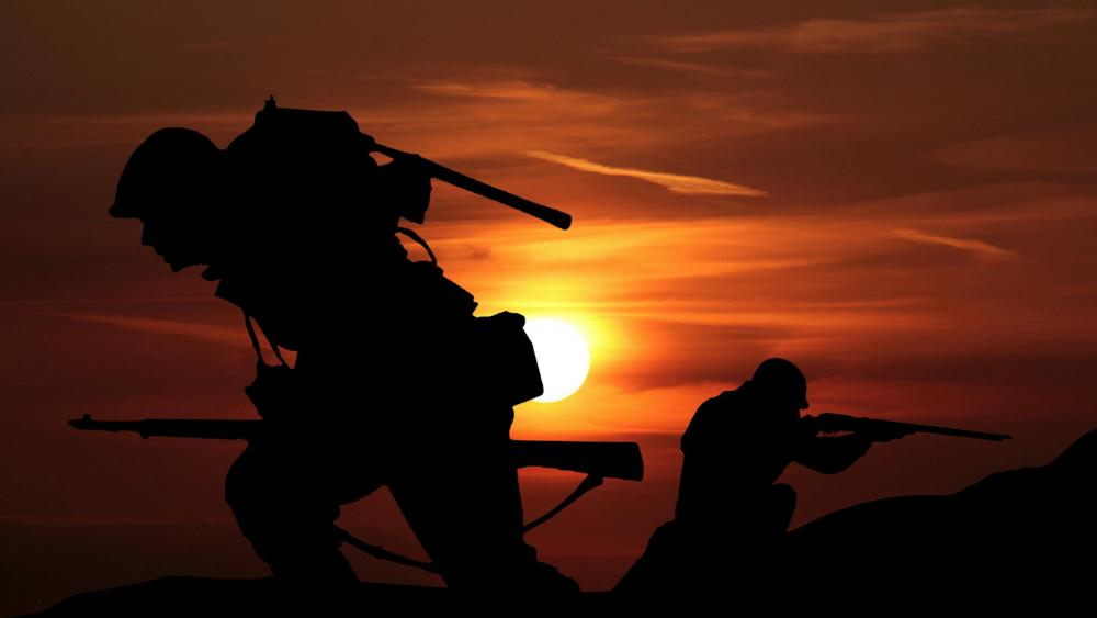 Soldier Silhouettes Against the Setting Sun wallpaper