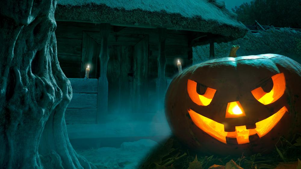 Eerie Halloween Night with Glowing Pumpkin wallpaper