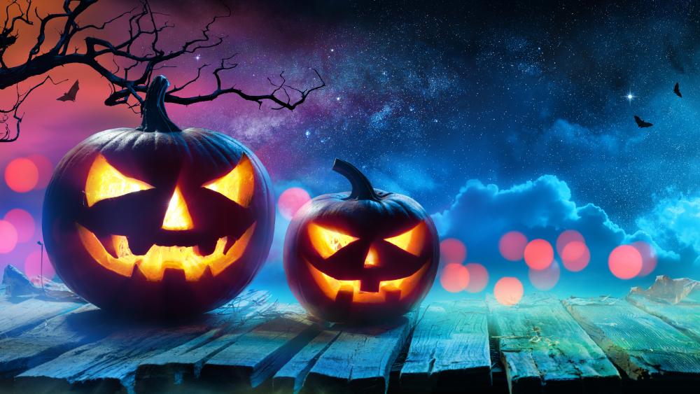 Spooky Halloween Night with Glowing Jack-o'-Lanterns wallpaper