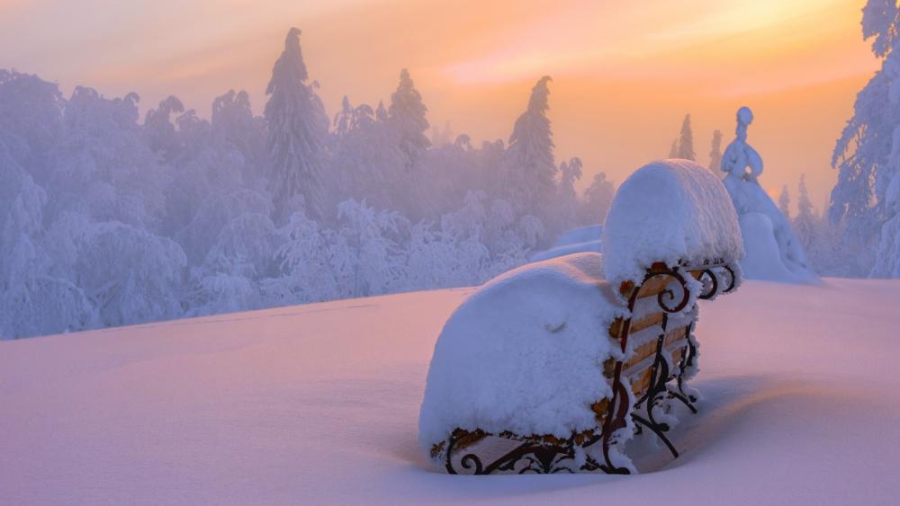 Snow covered bench wallpaper
