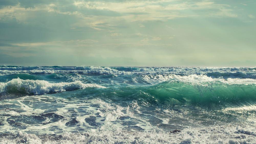 seascape-waves-sunrays wallpaper