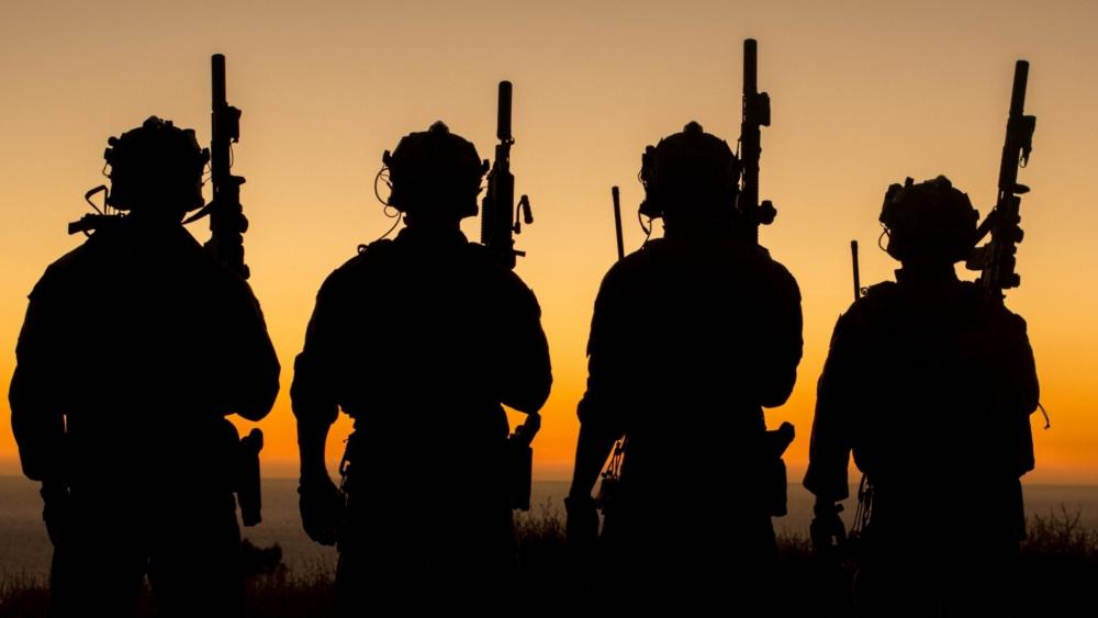 Silhouetted Soldiers at Sunset wallpaper