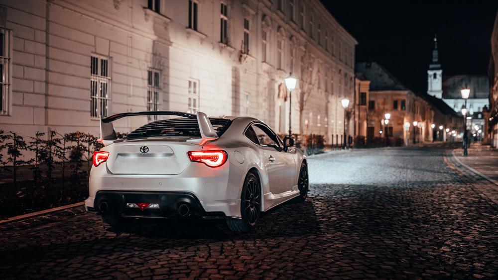 Nighttime Elegance on Cobblestone Streets wallpaper