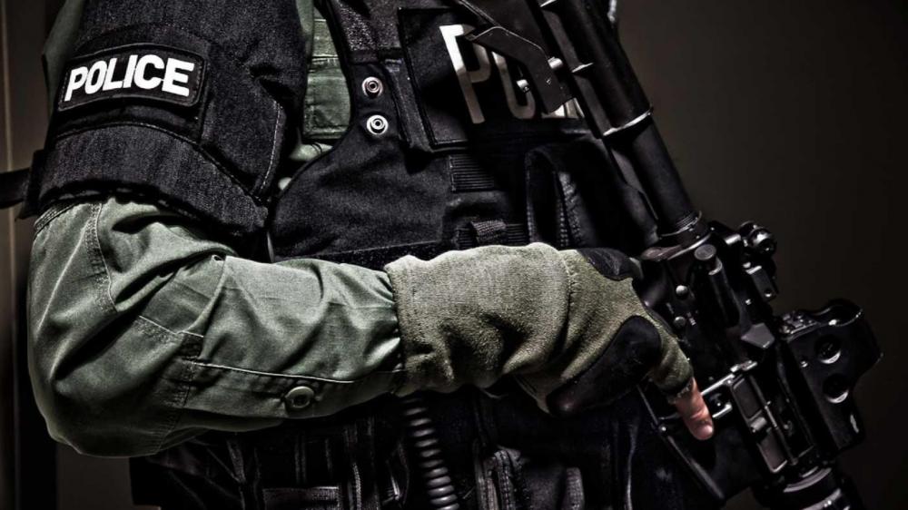 Armed Police Officer Ready for Duty wallpaper