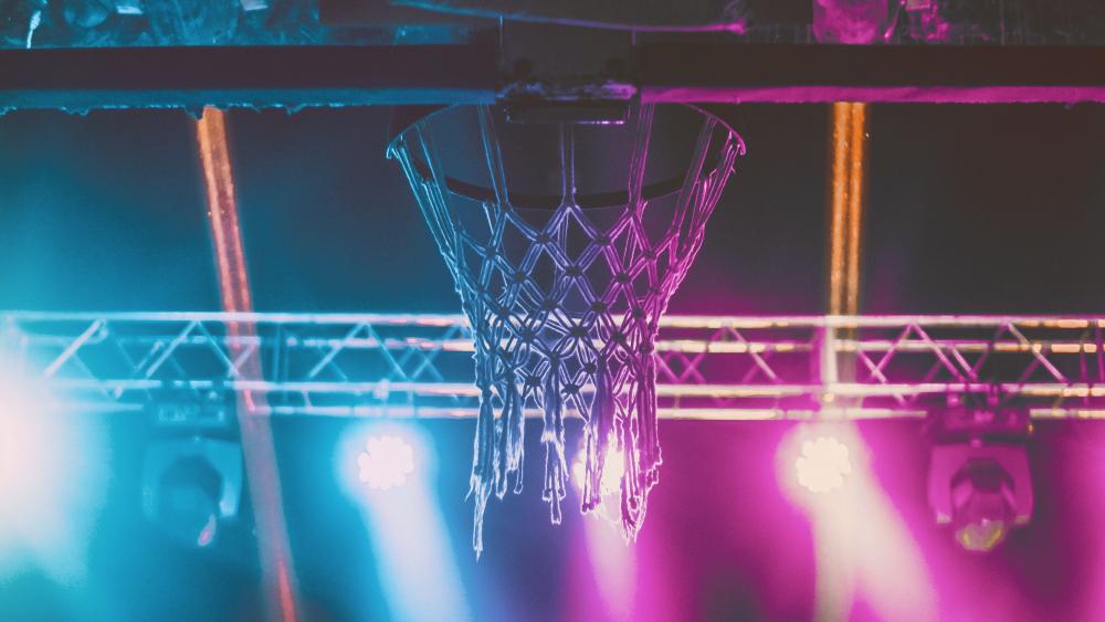 Neon Glow Basketball Hoop Under Night Lights wallpaper