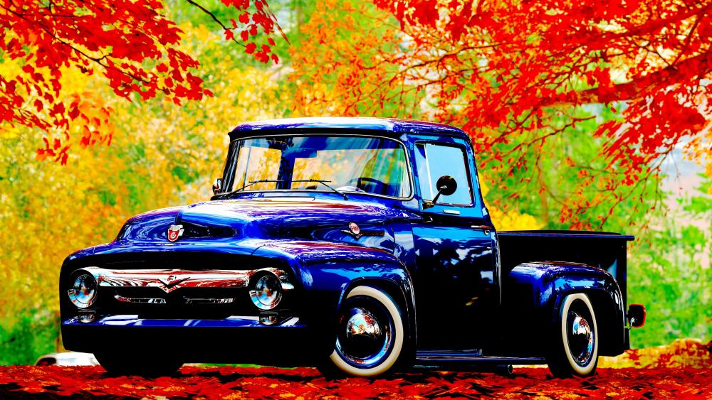 Classic Blue Truck Amidst Autumn Splendor wallpaper