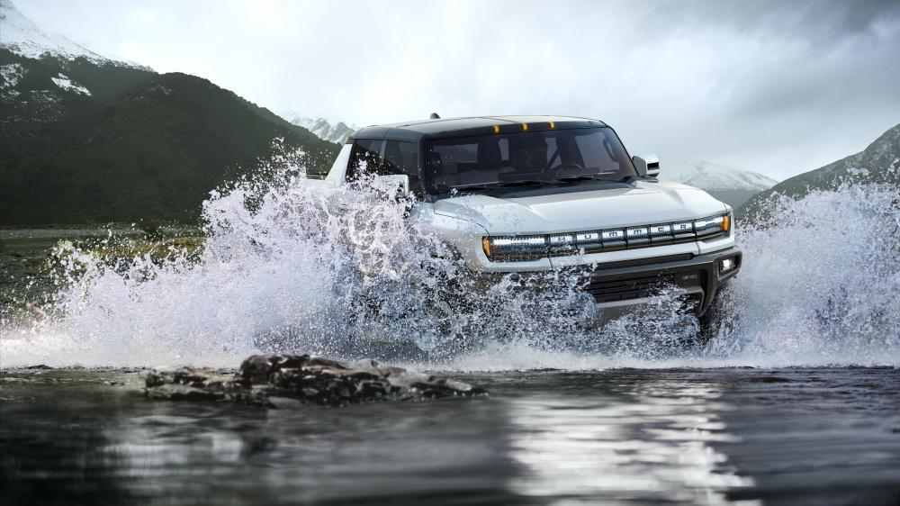 Rugged Hummer Conquers Mountain River wallpaper