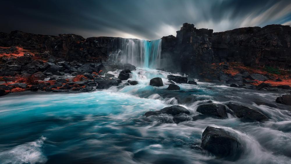 Majestic Öxarárfoss Waterfall in Twilight Ambiance wallpaper