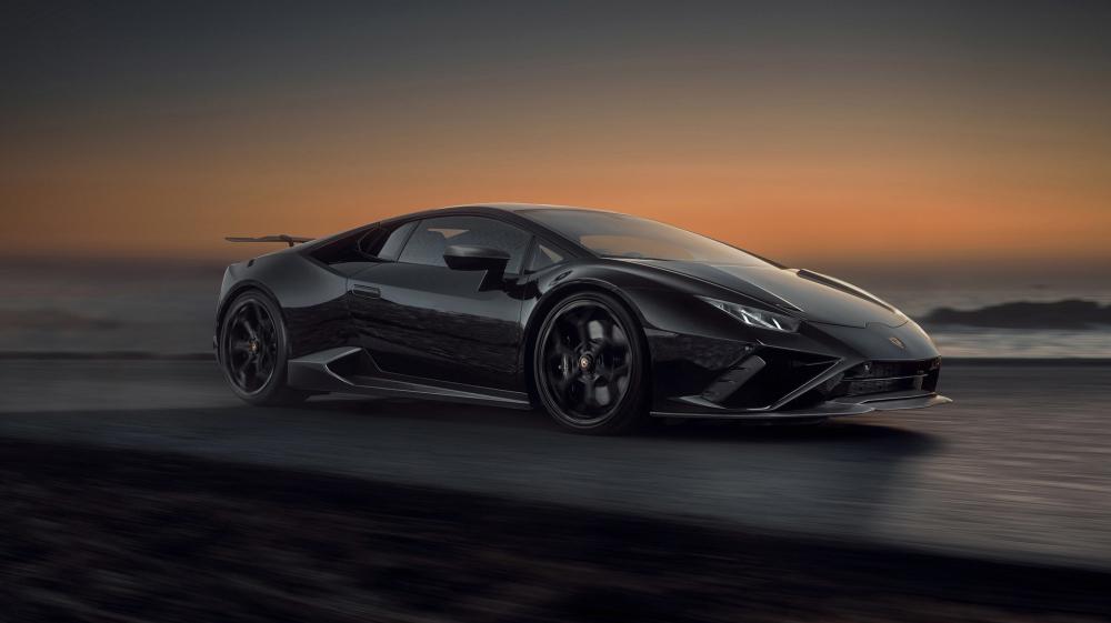 Sleek Speed On Ocean Road with a Lamborghini Huracan EVO wallpaper