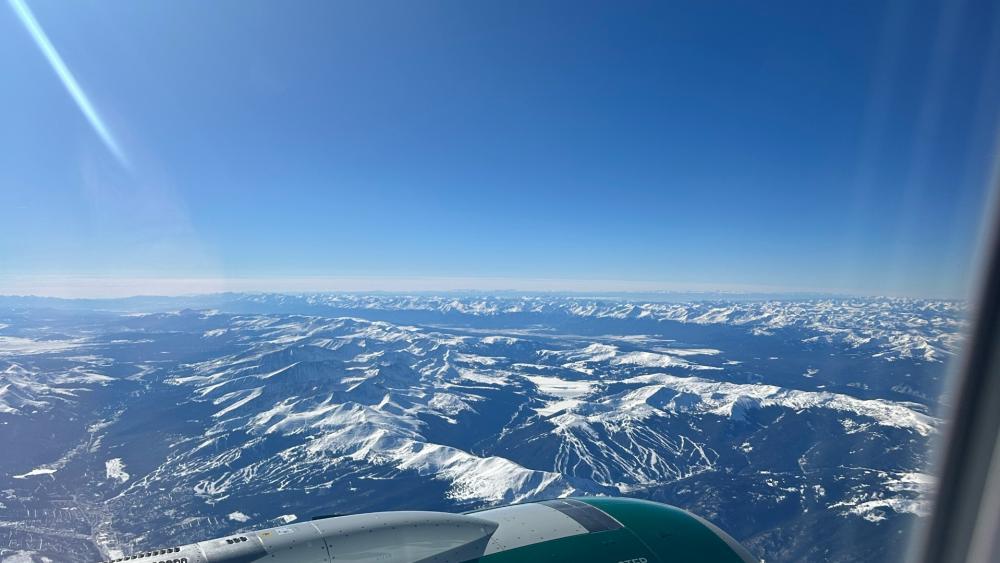 Majestic Snow-Capped Mountains Above the Clouds wallpaper