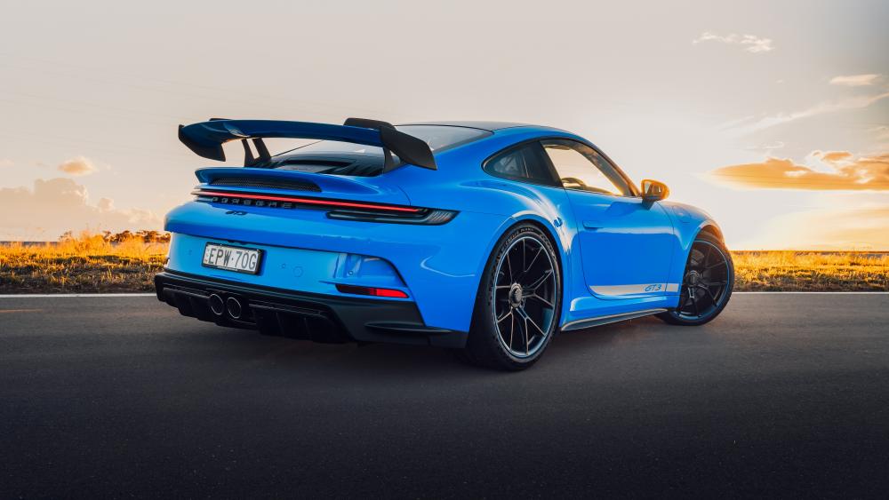 Sleek Blue Porsche 911 GT3 PDK Sports Car at Sunset wallpaper