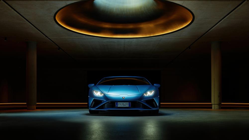 Lamborghini Huracan Luxury Car Under Golden Spotlight wallpaper