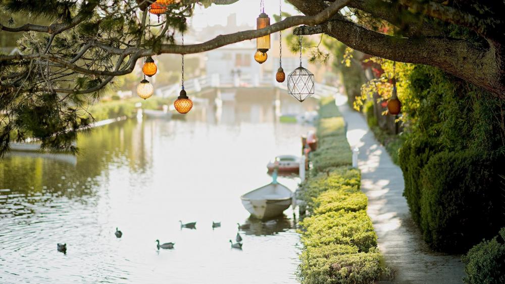 Serene Riverside Ambiance with Hanging Lanterns wallpaper