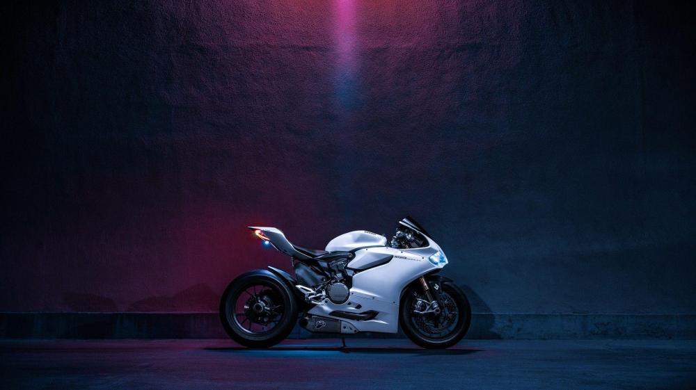 Sleek Motorcycle Under Neon Glow wallpaper