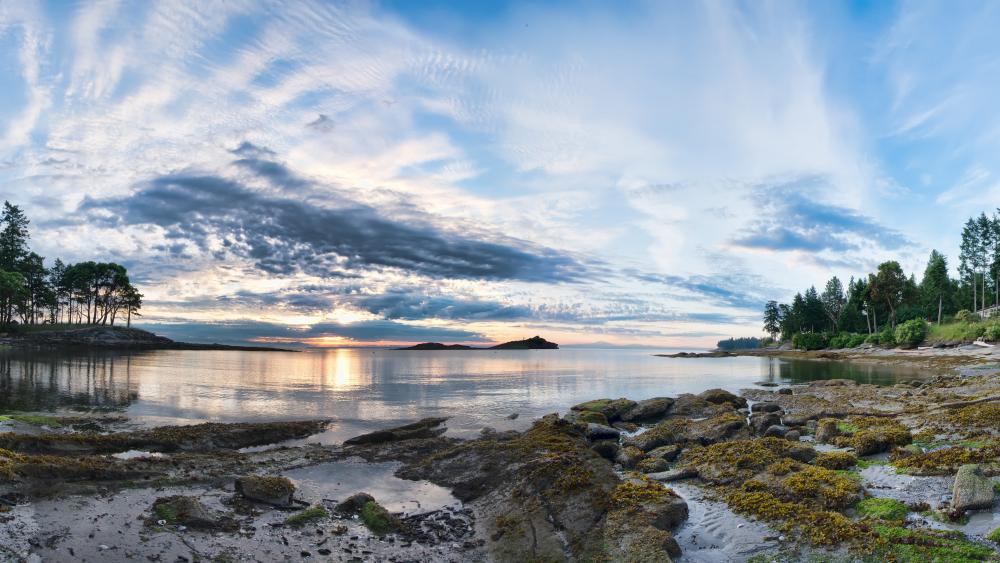 Serene Sunset at Rocky Shoreline wallpaper