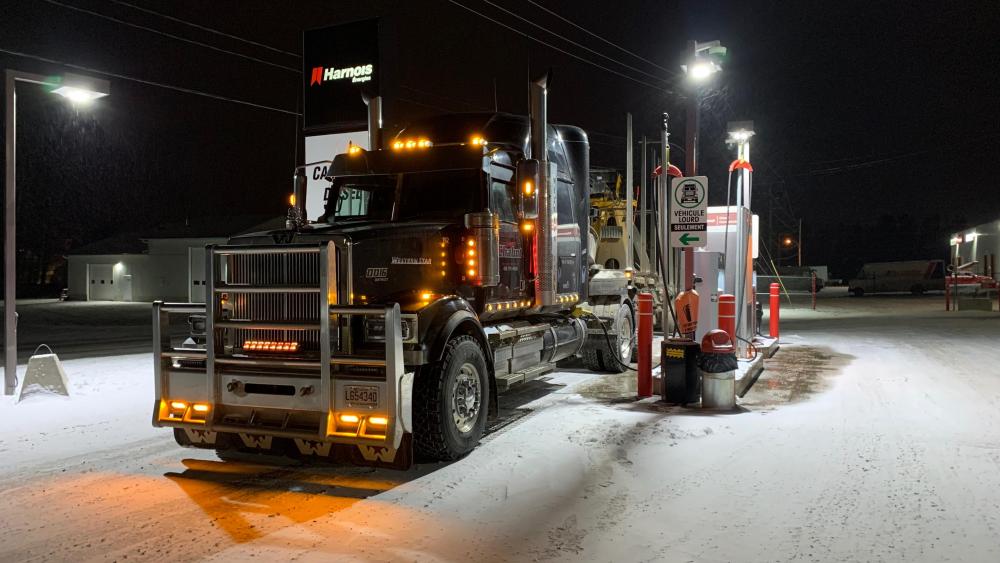 Majestic Truck Illuminates a Snowy Night wallpaper