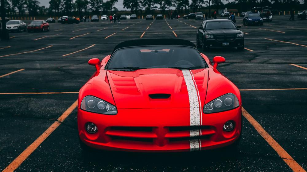 Red Sports Car Dominating the Parking Lot wallpaper