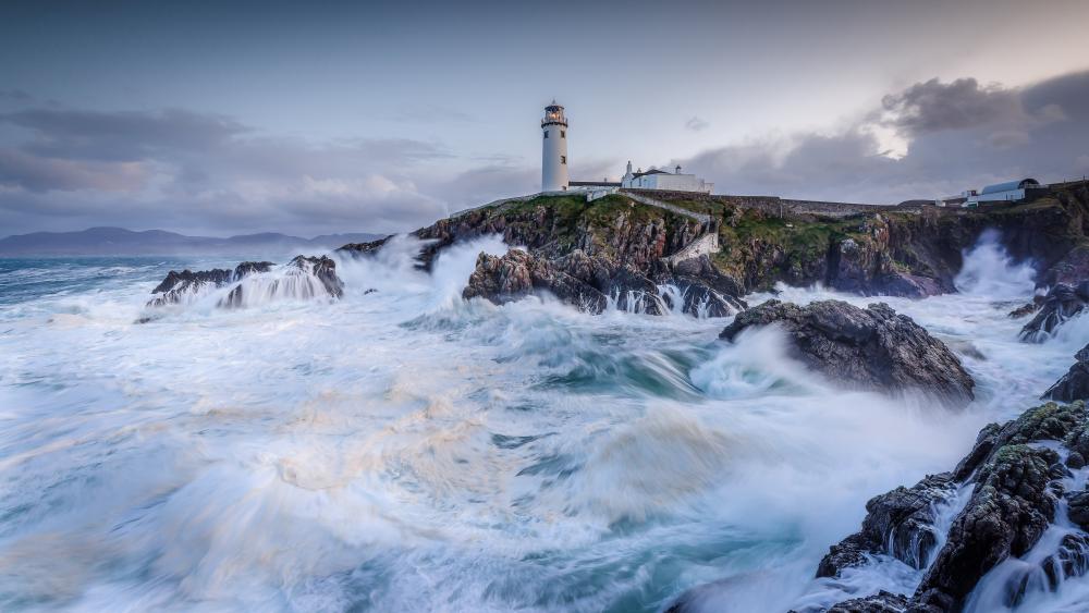 Fanad Head Lighthouse Amidst Stormy Seas wallpaper